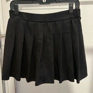 Short black pleated skirt